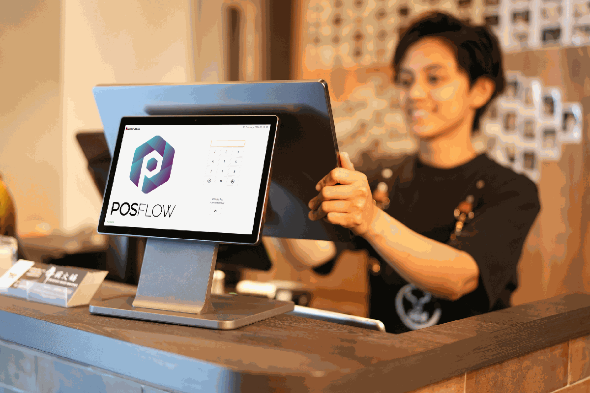 Staff member inputting an order on a hospitality POS terminal provided by POSFlow